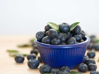 Fresh berries in a blue bowl