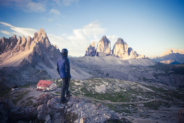 Man on the top of the mountain watching sunrise