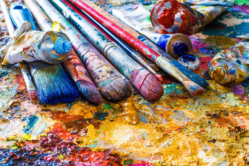 oil paints and paint brushes on a palette