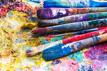 oil paints and paint brushes on a palette