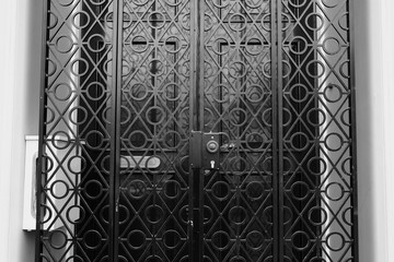 Black door with black fence detail