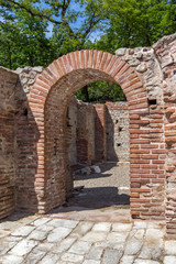 Fototapeta na wymiar Remainings of wall and pool in The ancient Thermal Baths of Diocletianopolis, town of Hisarya, Plovdiv Region, Bulgaria