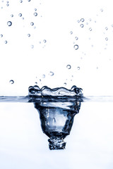Abstract background.A drop of water close on a white