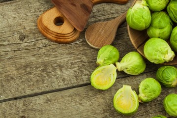 Brussels sprouts on old wooden table. Homework fresh vegetables. Growing vegetables on the farm. Preparing vegetarian food. Diet food.