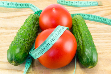 Cucumber and tomato with measuring