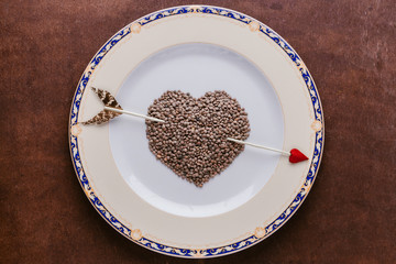 Dish with heart of lentils, valentines day