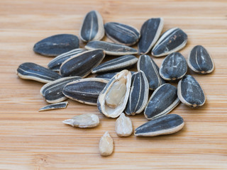 sunflower seeds on wooden table.