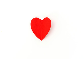 Red paper origami heart  on white background .