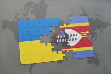 puzzle with the national flag of ukraine and swaziland on a world map