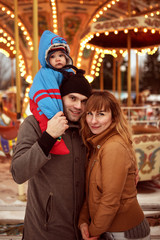 Fototapeta na wymiar happy family with child posing outdoor