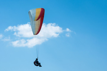 Paraglider flying in the sky. Paragliding.