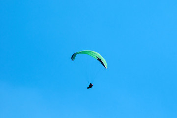 Paraglider flying in the sky. Paragliding.