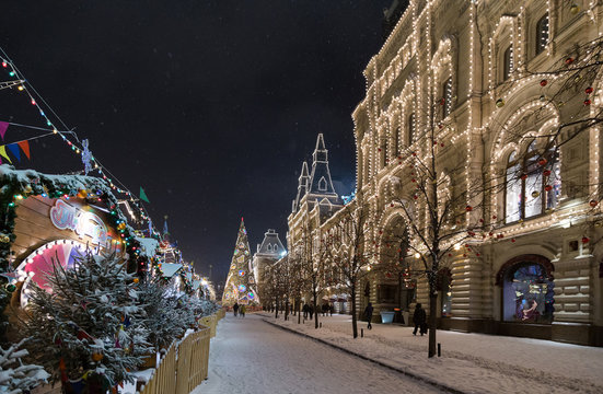 Russia, Moscow, Red Square. State Department Store (GUM) with the Christmas decorations. Snowfall night.