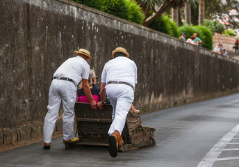 Toboggan riders on sledge in Monte - Funchal Madeira Portugal