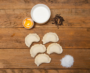 Dumplings with cottage cheese and sour cream closeup.