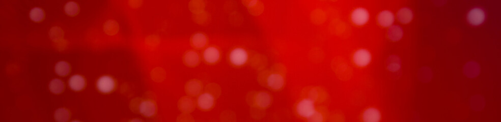 Glitter sparkling abstract red bokeh defocused background, border design panoramic banner