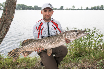 Fisherman with pike trophy