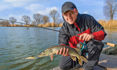 Fisherman with pike