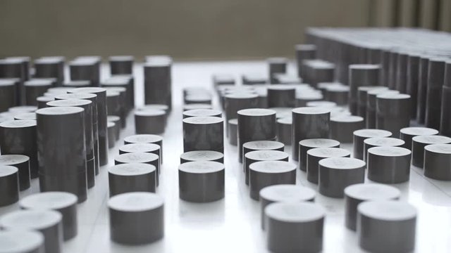 Factory. worker lays varistors on a special table. Slide