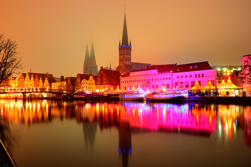 Fototapeta premium View of the pier architecture in Lubeck at night, Germany