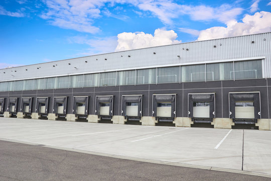 Loading Dock Cargo Doors At Big Warehouse, Building Exterior