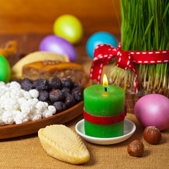Colored eggs, wheat springs Nowruz Holiday in Azerbaijan. Selective focus.