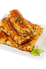 Russian Stuffed Pancakes Blintzes with Meat Isolated on White. Selective focus.