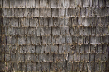 Background wall of rough weathered grey cedar shakes shingles