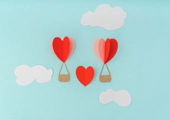 Obraz na płótnie Canvas Paper cut of Heart Hot air balloons for Valentine's Day celebrat