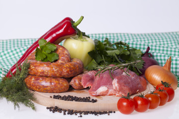 raw homemade sausages and fresh pork meat