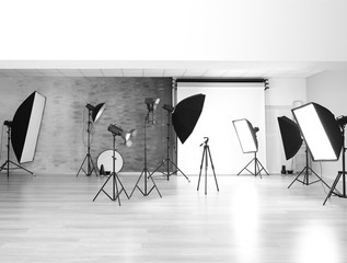 Empty photo studio with lighting equipment