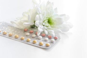 concept of female contraception on white background