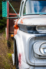 Fototapeta premium Close-up of old truck in a field