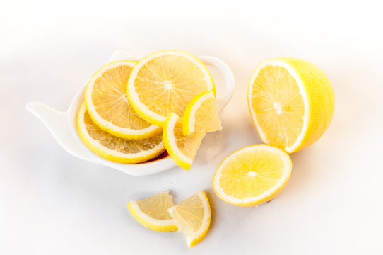 Lemon sliced lies on a plate shaped
