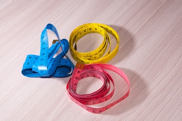 Blue, red and yellow centimeter on the table