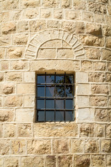 Fototapeta na wymiar Barred window, Montefiore Windmill, Jerusalem
