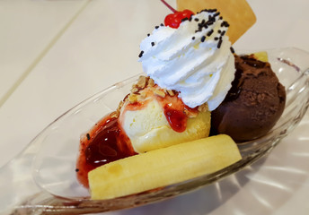 Banana split with ice cream and topping