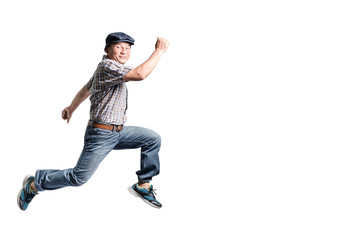Portrait of a happy mature man jumping forward. Isolated full bo