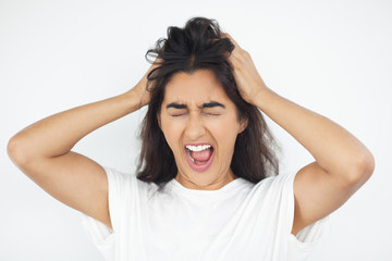 Stressed Indian Woman Clutching Head and Screaming