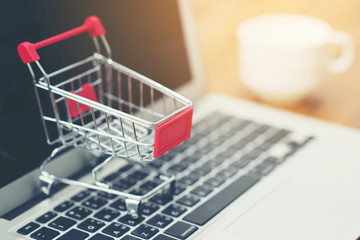 Shopping Cart, labtop pc, on wood background , online shopping concept