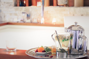 Fototapeta na wymiar Chamomile tea with teapot near jacuzzi. Valentines background. R