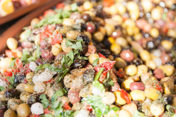 Antipasto pickled olives and food in market bowls, Colombiers, France