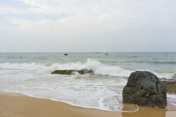 Mui Ne beach, Vietnam, a beautiful beach with long coastline, silver sand and huge waves, in an early morning