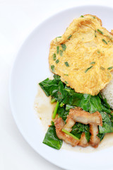 Stir fried kale with crispy pork and Thai Omelette with rice in white dish iIsolated on white background, Thai Food