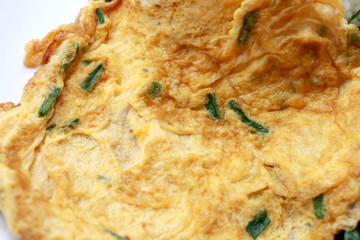 Omelet served with jasmine rice in white dish isolated on white background