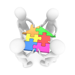 People holding house puzzle in hands. 