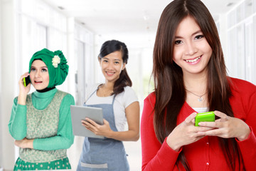 group of people using mobile phone. attractive woman at the fron