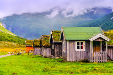 Typical house with grass on the roof in a mountain village. Norway