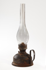 Fototapeta na wymiar The old, shabby kerosene lamp. The lamp of past times. Isolated. On a white background