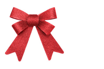 Bright red bow over white background